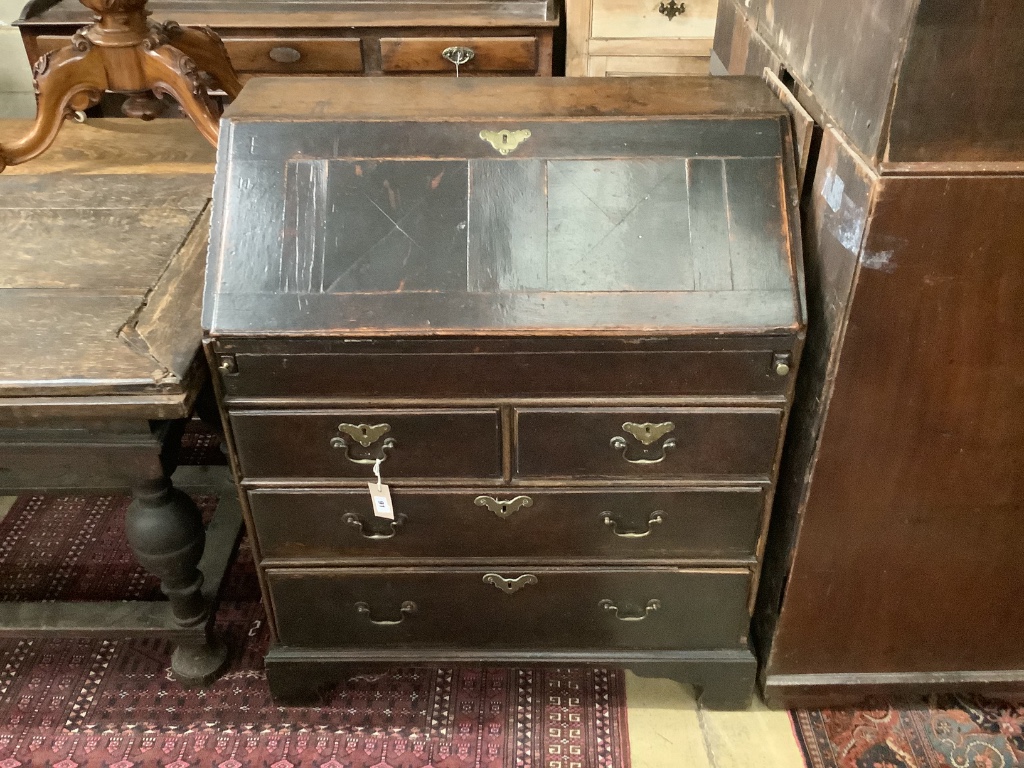 A mid 18th century oak bureau, width 88cm, depth 50cm, height 105cm